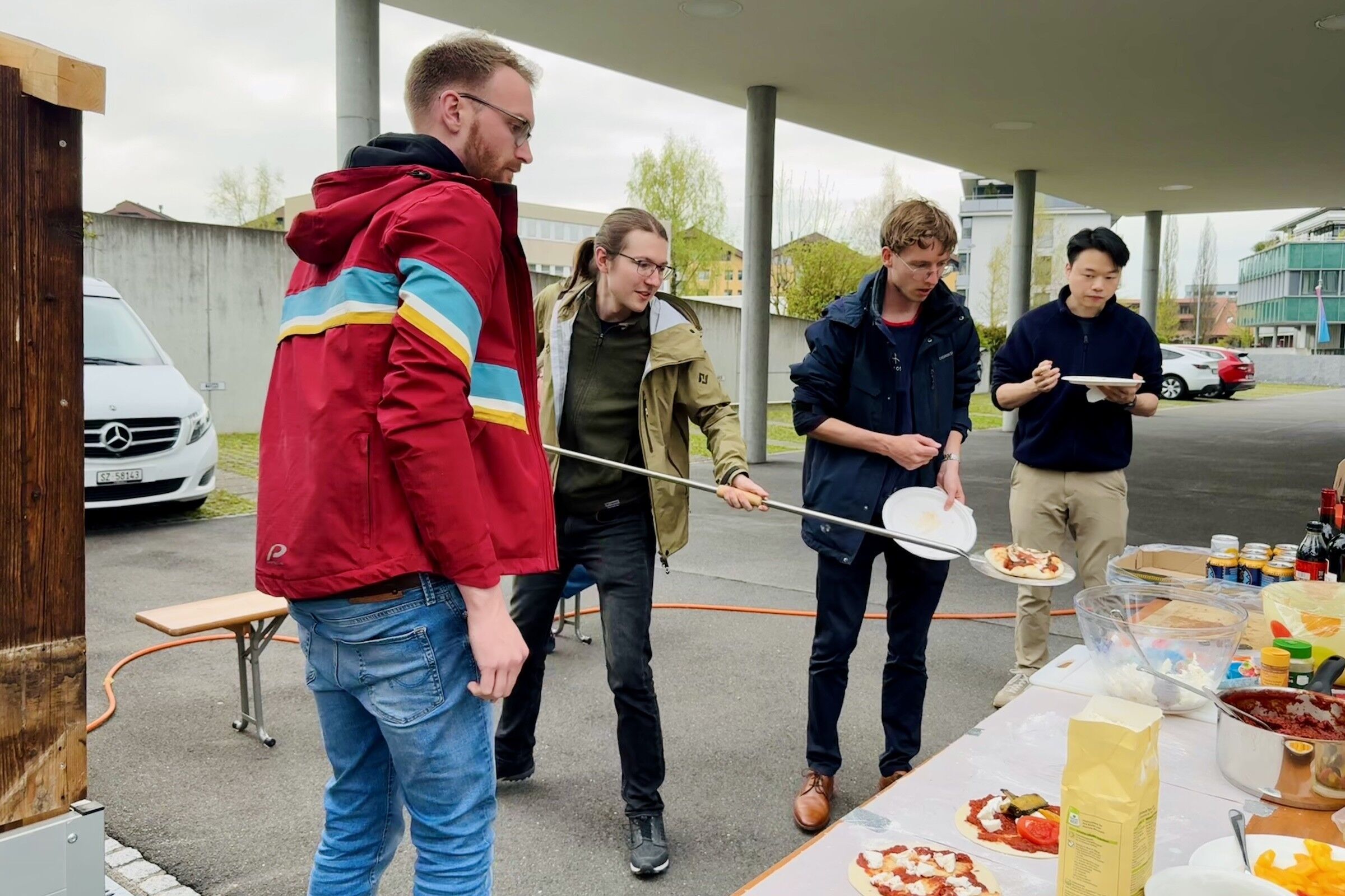 Experts handling pizzas